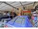 Garage with various tools, equipment, and two vehicles at 209 10Th Ave, Idaho Springs, CO 80452