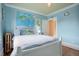Serene bedroom with a nautical theme and hardwood floors at 209 10Th Ave, Idaho Springs, CO 80452
