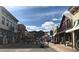 View down a street with shops and people walking at 209 10Th Ave, Idaho Springs, CO 80452