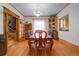 Formal dining room with hardwood floors, a built-in hutch, and wood trim at 209 10Th Ave, Idaho Springs, CO 80452