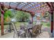Pergola with patio furniture and mountain backdrop at 209 10Th Ave, Idaho Springs, CO 80452