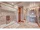 Bathroom with walk-in shower and single vanity at 934 S Perry Park Rd, Sedalia, CO 80135