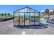 Greenhouse with raised garden beds and various gardening supplies at 934 S Perry Park Rd, Sedalia, CO 80135