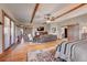 Main bedroom suite with sitting area, large windows, and hardwood floors at 934 S Perry Park Rd, Sedalia, CO 80135