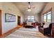 Spacious main bedroom with high ceilings, hardwood floors, and a sitting area at 934 S Perry Park Rd, Sedalia, CO 80135
