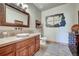 Elegant bathroom with vessel sink, tile flooring, and decorative mirror at 934 S Perry Park Rd, Sedalia, CO 80135