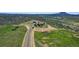 Aerial view of the house and surrounding landscape at 934 S Perry Park Rd, Sedalia, CO 80135