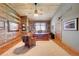Rustic-chic home office with wood-paneled walls and built-in shelving at 934 S Perry Park Rd, Sedalia, CO 80135