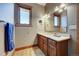 Bathroom with wood vanity and granite countertop at 934 S Perry Park Rd, Sedalia, CO 80135