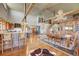 Open concept kitchen with island, dining area, and hardwood floors at 934 S Perry Park Rd, Sedalia, CO 80135