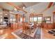 Elegant dining room featuring a rustic wooden table and built-in cabinetry at 934 S Perry Park Rd, Sedalia, CO 80135