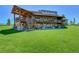 Luxury home with expansive deck and professionally landscaped lawn at 934 S Perry Park Rd, Sedalia, CO 80135