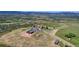 Aerial view of property showcasing home, expansive land, and mountain views at 934 S Perry Park Rd, Sedalia, CO 80135