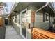 Front entrance with gray siding and modern wood fence at 963 N Newton St, Denver, CO 80204