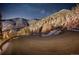 Nighttime view of a winding mountain road under a starry sky at 1300 Main St, Georgetown, CO 80444