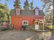 Red barn-style home with stone accents at 1300 Main St, Georgetown, CO 80444