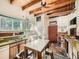 Rustic kitchen with wood cabinets and stone floor at 1300 Main St, Georgetown, CO 80444