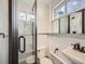 Clean bathroom with white subway tiles, a pedestal sink and a shower at 1300 Main St, Georgetown, CO 80444