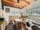 Bright kitchen with green countertops and a washer and dryer at 1300 Main St, Georgetown, CO 80444