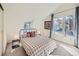 Bright bedroom with plaid bedding and large windows at 1300 Main St, Georgetown, CO 80444