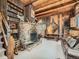 Rustic living room with exposed beams and brick fireplace at 1300 Main St, Georgetown, CO 80444