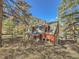 Red barn-style home with wood siding at 1300 Main St, Georgetown, CO 80444