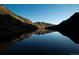 Stunning mountain lake reflecting the sky and surrounding peaks at 1300 Main St, Georgetown, CO 80444