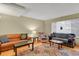 Living room with hardwood floors, comfortable seating, and patterned rug at 562 S Xenon Ct, Lakewood, CO 80228