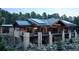 Stunning stone house with metal roof, expansive deck, and mountain views at 7474 Spring Drive, Boulder, CO 80303