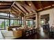 Spacious living room with high ceilings, stone accents, and large windows at 7474 Spring Drive, Boulder, CO 80303