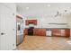 Kitchen with stainless steel appliances and wood cabinets at 5912 Turnstone Pl, Castle Rock, CO 80104