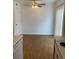 Dining area features wood-look flooring and a ceiling fan at 912 S Peoria St, Aurora, CO 80012