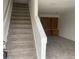 Image shows a carpeted staircase leading to an upper level with built-in shelving at 912 S Peoria St, Aurora, CO 80012
