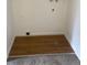 Laundry area with wood-look flooring and hookups for a washer and dryer at 912 S Peoria St, Aurora, CO 80012