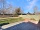 Large backyard with wooden deck and grassy area at 6045 Garrison St, Arvada, CO 80004