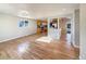 Open dining area with hardwood floors and kitchen views at 6045 Garrison St, Arvada, CO 80004