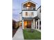 Modern farmhouse with a two-car garage and a front yard at 1411 Zenobia St, Denver, CO 80204