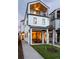 Modern two-story home with a wraparound porch and landscaped yard at 1411 Zenobia St, Denver, CO 80204