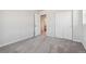 Empty bedroom with closet, carpet flooring, and ensuite bathroom at 3352 N Highlands Creek Pkwy, Aurora, CO 80019