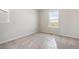Unfurnished bedroom with carpet and a large window with a view at 3352 N Highlands Creek Pkwy, Aurora, CO 80019
