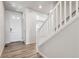 Inviting entryway with wood-look flooring and a staircase at 3352 N Highlands Creek Pkwy, Aurora, CO 80019
