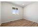 Bright home office or study with wood-look flooring and large window at 3352 N Highlands Creek Pkwy, Aurora, CO 80019