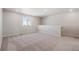 Carpeted loft area with a window and a half-wall at 3352 N Highlands Creek Pkwy, Aurora, CO 80019