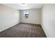 Bright bedroom with carpet flooring and a window offering a view at 4828 Ceylon Way, Denver, CO 80249