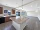 Open kitchen with granite island and modern appliances at 4828 Ceylon Way, Denver, CO 80249