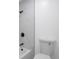 Clean bathroom with toilet and marble shower surround at 14467 E 1St Dr # B09, Aurora, CO 80011