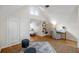 Bright bonus room with built-in shelving and a workspace at 1516 Lafayette St, Denver, CO 80218