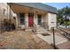 House exterior with red door and steps leading to the porch at 1516 Lafayette St, Denver, CO 80218