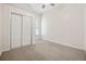 Simple bedroom with neutral walls and carpet flooring at 1516 Lafayette St, Denver, CO 80218
