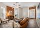 Living room with exposed brick wall and seating area at 1516 Lafayette St, Denver, CO 80218
